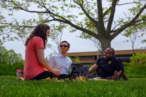 PBAs sitting on the North Campus Grove