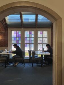 students study in near the League's stained glass windows