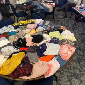 Clothing on a table at a clothing swap